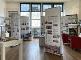 interior of building featuring exhibition banners and objects
