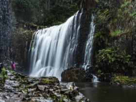 Wander along the 300 meeting river walk to the base of Guide Falls