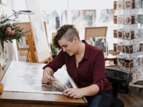 Jenna Chartrand at her desk drawing