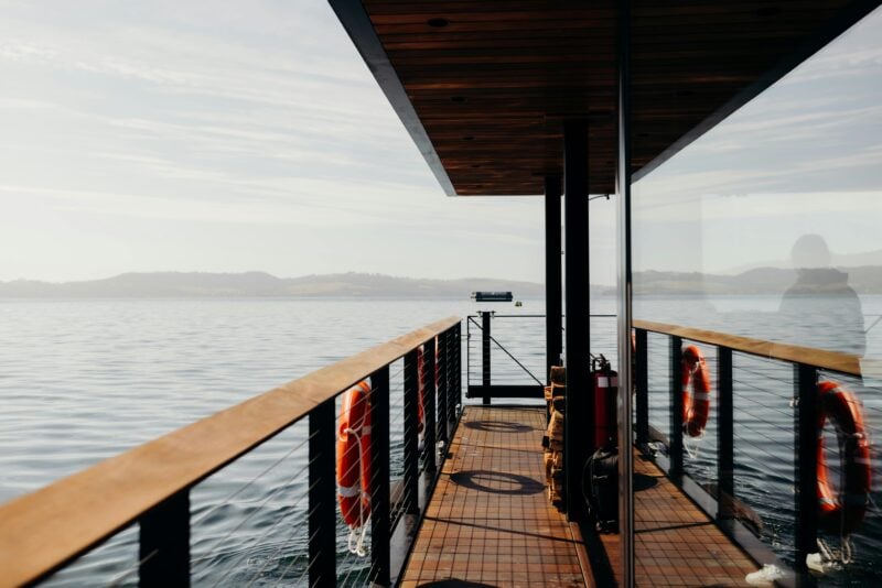 View looking down the side of a sauna boat while cruising