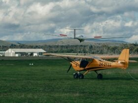 one powered plane, one glider, one hanger