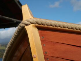Close up of wooden dinghy.