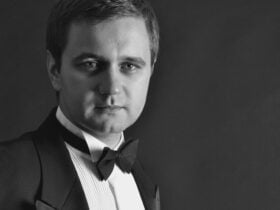 Alexey in black tie attire