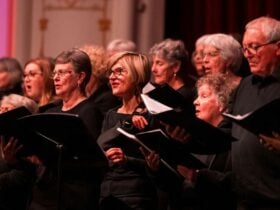 A group of singers dressed in black