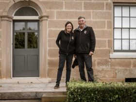 Michael and Deb in front of 1823 house