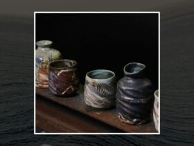 A series of ceramics in a row, dark browns and patterns