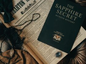 the invitation to the Murder Mystery Garme sits on a leather chair with a sapphire jewell closeby