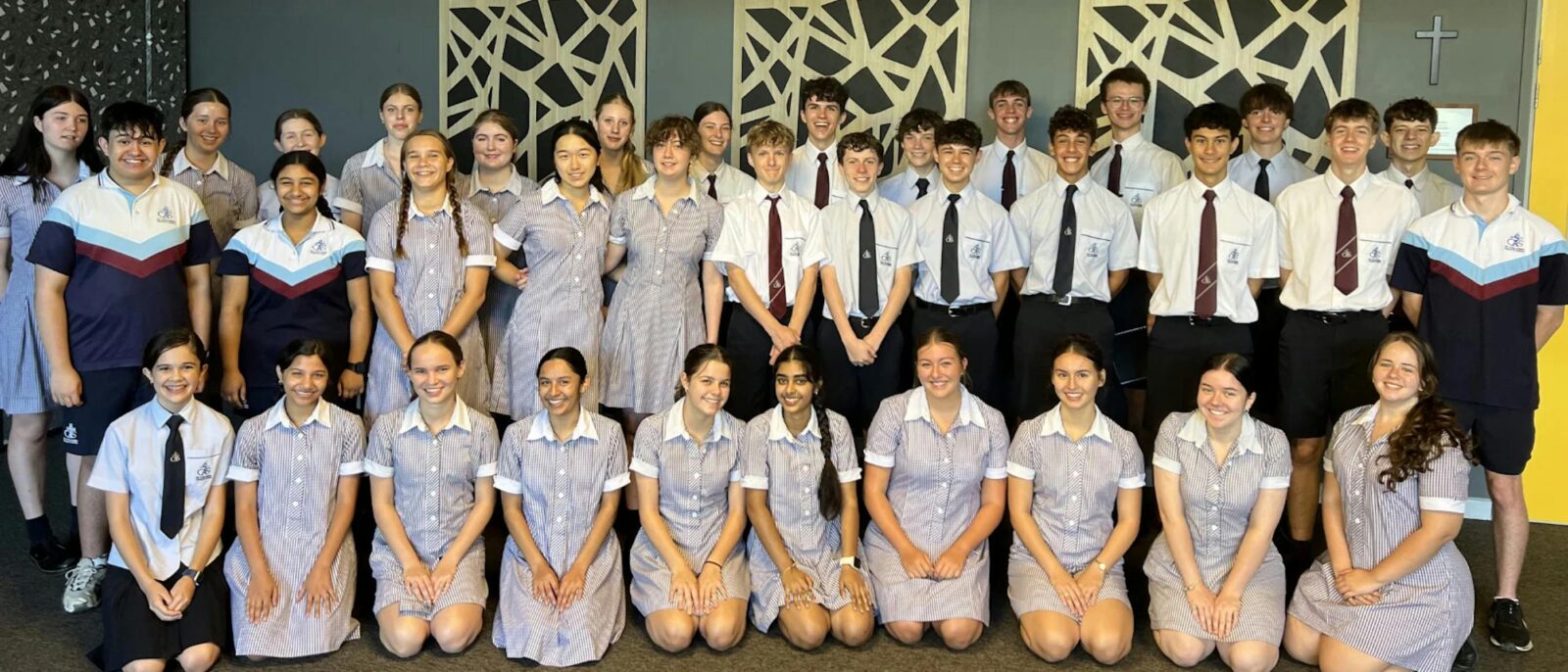A choir of school children smiling