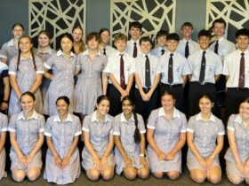 A choir of school children smiling