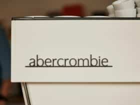 An off-white commercial coffee machine with the text 'Abercrombie' on its front.