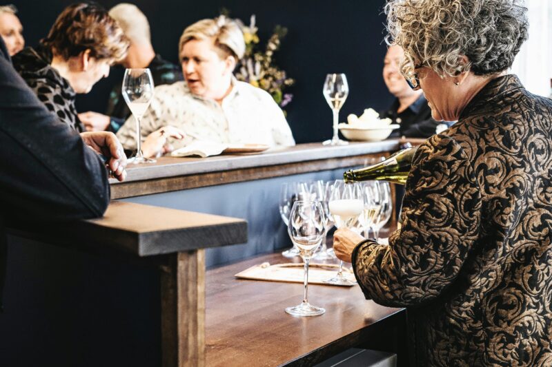 Wine Bar in Action. Lucy pours drinks for guests.