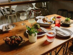 picture of a table showing cocktails and bar snacks