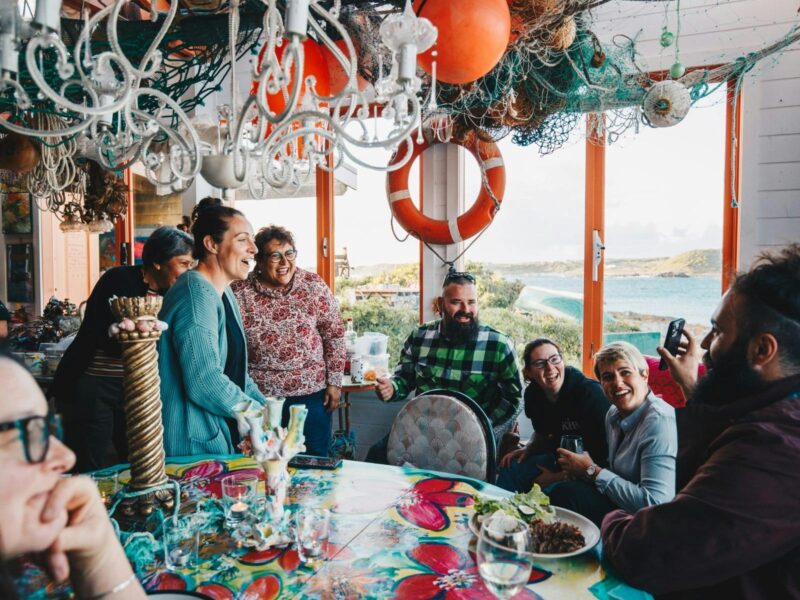 Group of people enjoying dinner at The Boathouse