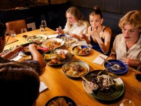 People sharing a banquet of Greek dishes at Urban Greek restaurant in Hobart.