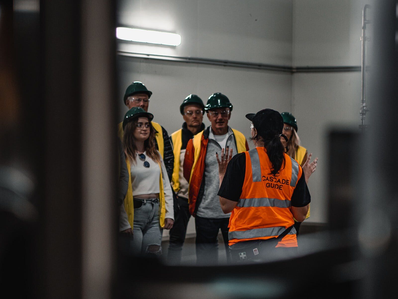 Tour Guide speaking to group inside fermentation cellar