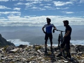 MTB Riders taking images of themselves before riding the Nth Owen Descent trail.