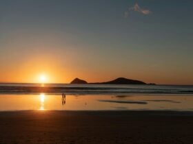Couple walking along beach Wilsons Prom