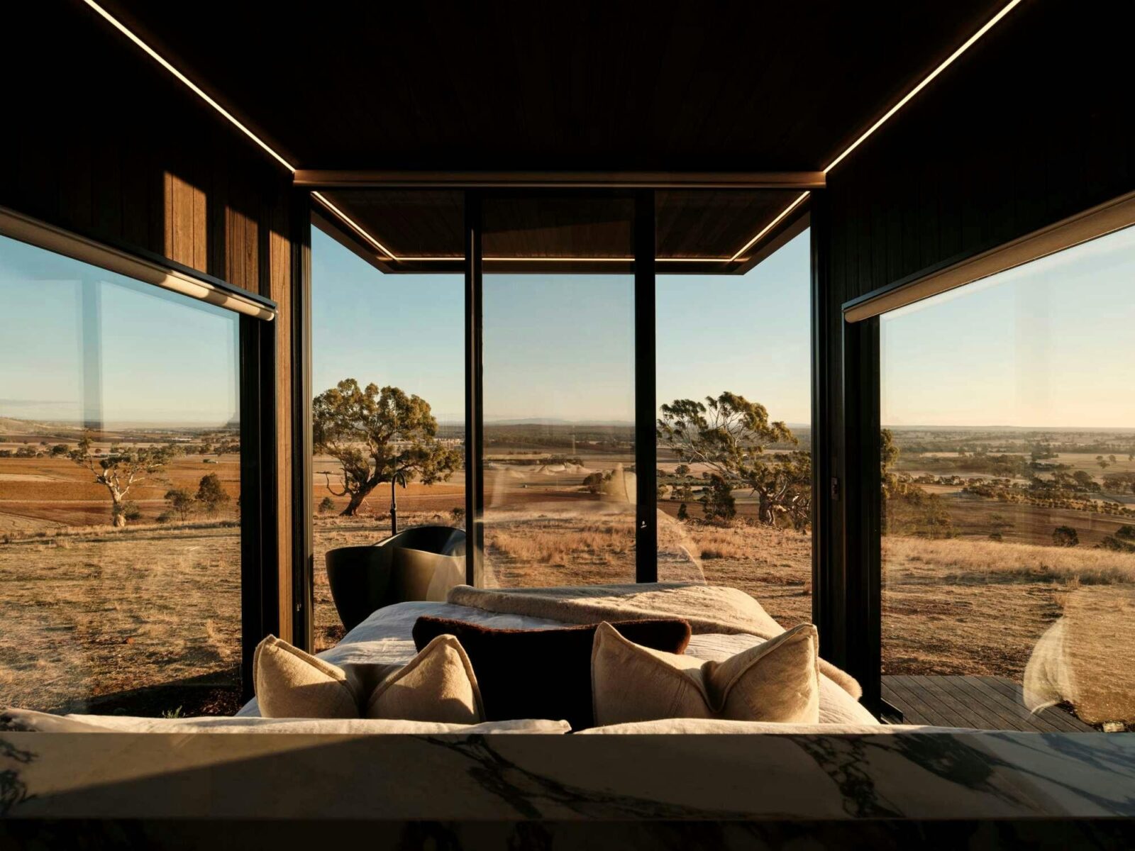 Eco-luxury cabin in Heathcote overlooking sweeping winery landscapes during sunrise