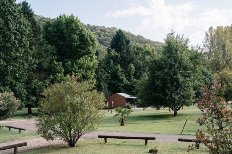 Harrietville Cabins from a distance surrounded by mountains