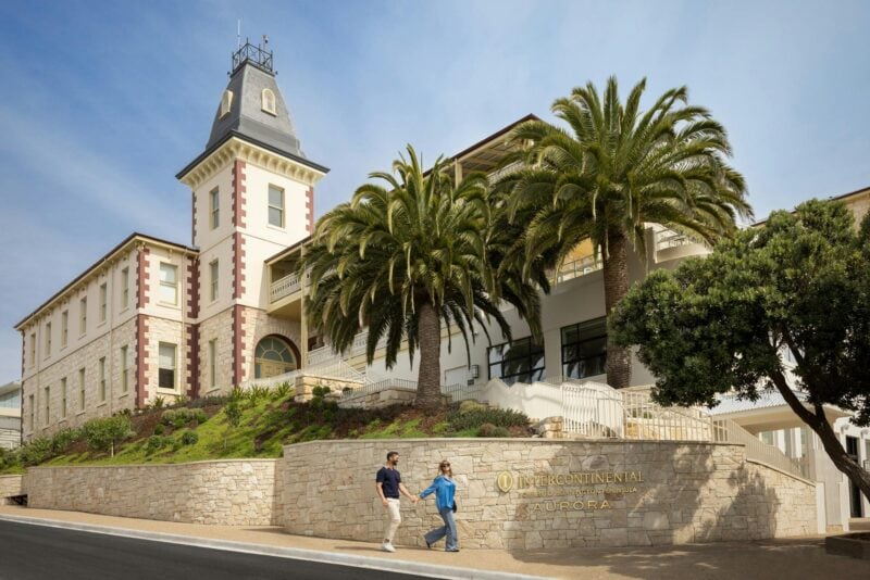 Hotel Exterior with couple holding hands along the footpath in the foreground