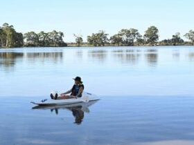 Person canoeing on a large lake