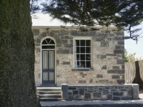 view of the front of the cottage with afternoon light