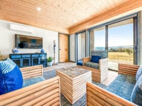 Blue denim themed lounge room with beautiful valleys views
