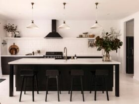 The heart of this space is a striking black Smeg oven, which is surrounded by vintage elegance