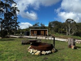 Retreat exterior with a fire pit