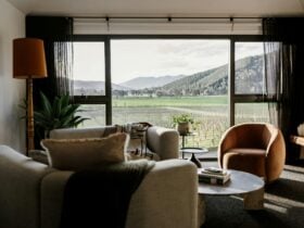interior of Marsden with couches and floor to ceiling windows looking onto the winery and hills