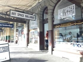 Street frontage of Art Space looking onto windows and footpath with A frame signage.