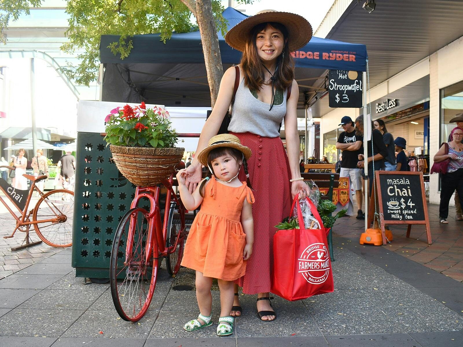Woman and girl at Farmers Market Day at the Bridge Mall