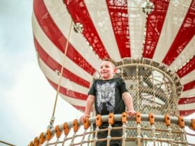Child climbing the balloons