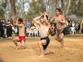 Group of Yorta Yorta dancers performing in front of a crowd at Dharnya Centre.