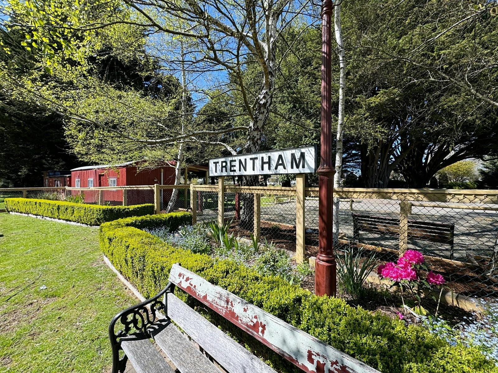Trentham signage with a bench