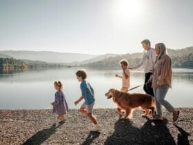 Family walking dog at Eildon Pondage