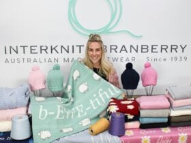 Owner of the business with some bright woollen knitwear