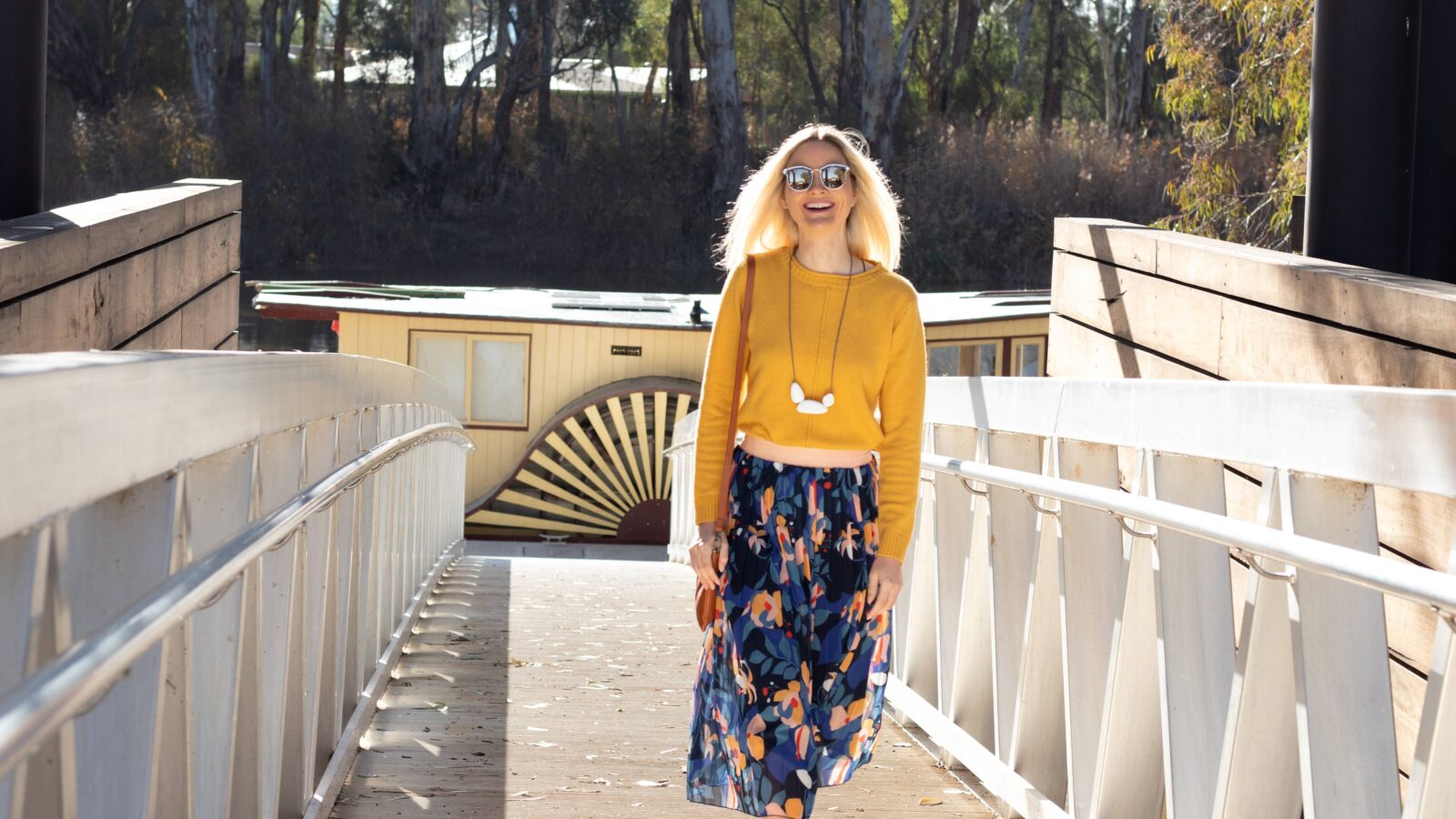 Visitor walking up the walkway from the floating pontoon of the Koondrook Wharf