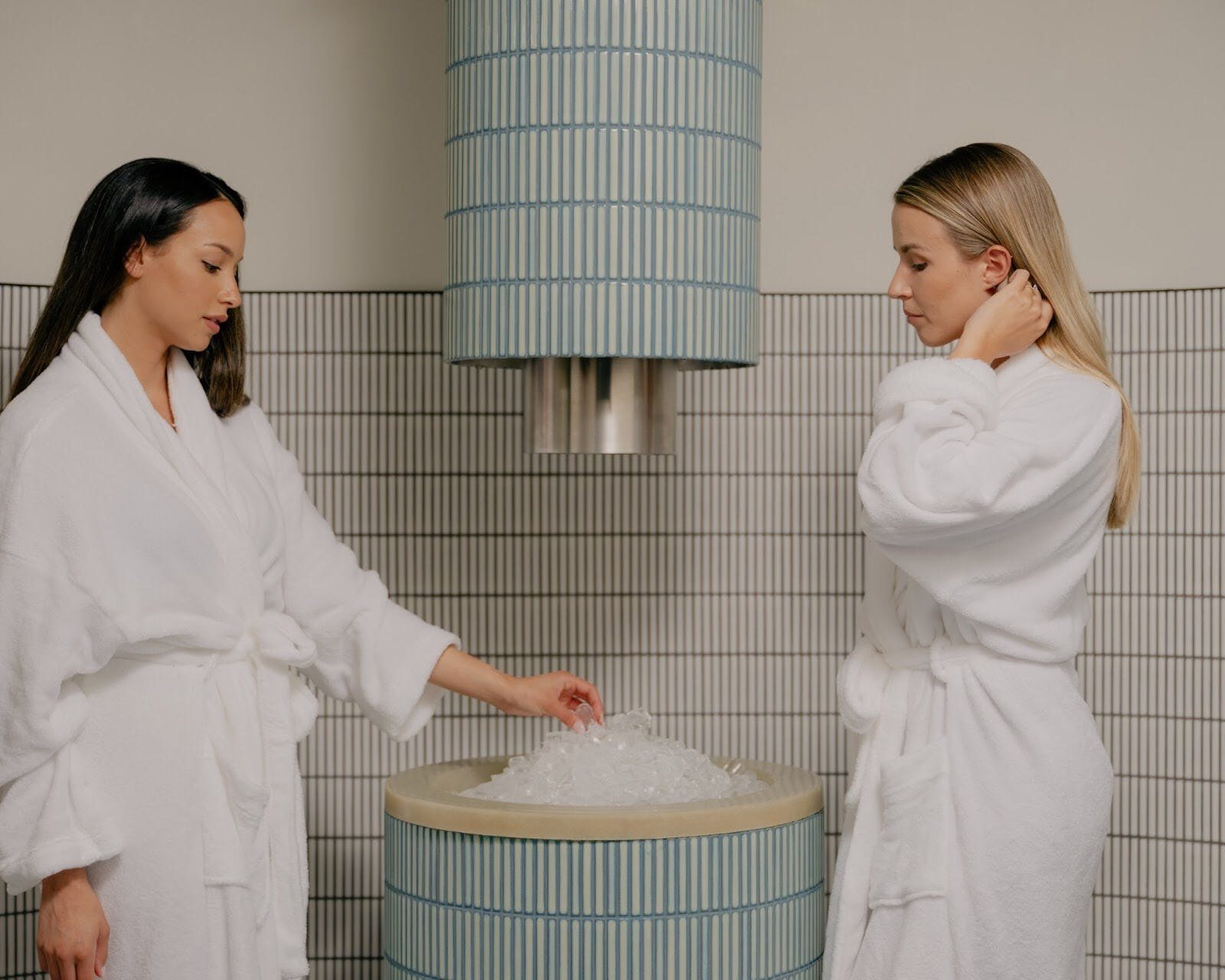 Two ladies standing at the ice fountain