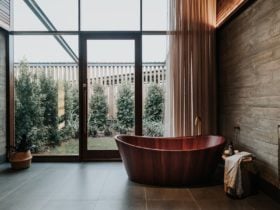 Treatment room featuring stunning red wood bath