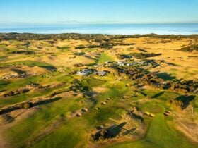 the golf course with the ocean in the background