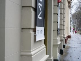 The front of the Museum, with a family approaching the doors
