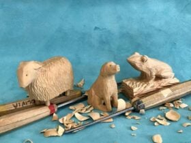 Three wooden carved animal statues