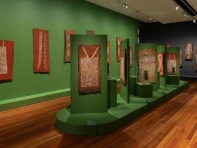 A photograph of exhibition space displaying Bark paintings