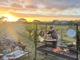 Cheese, figs, walnuts being cooked over fire by Tom Ballinger of Coal Catering