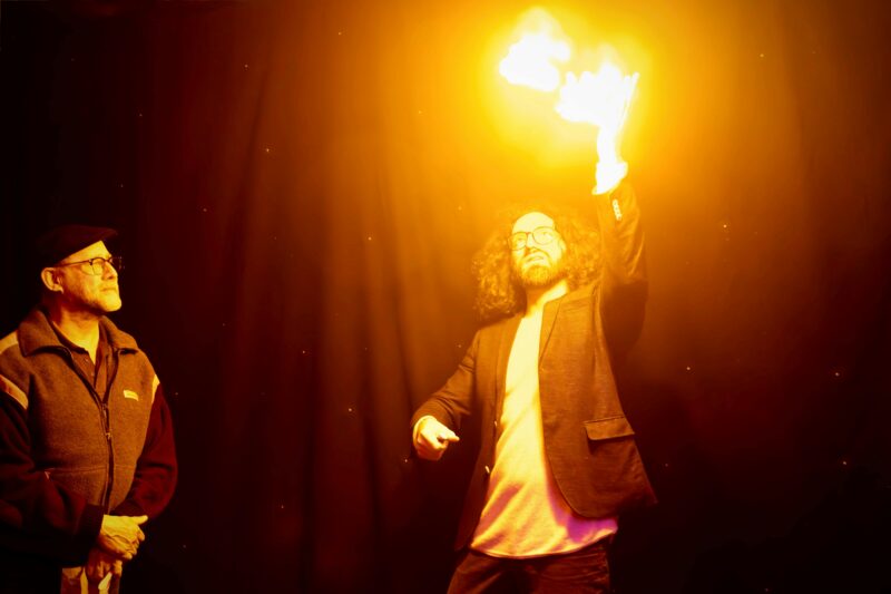 Davide produces a flame from his hands