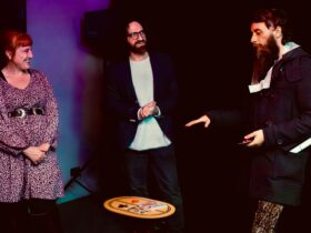Davide performs with two spectators on stage