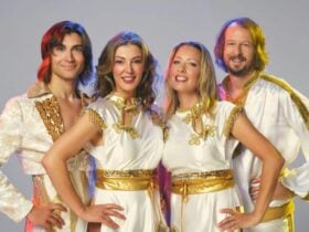 2 men and 2 women standing next to each other in costume.