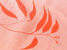 Orange leaf print on pink fabric