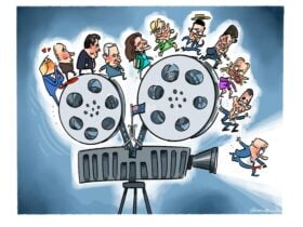 Various world leaders skip over the top of a giant film projector. At the front, PM Anthony Albanese